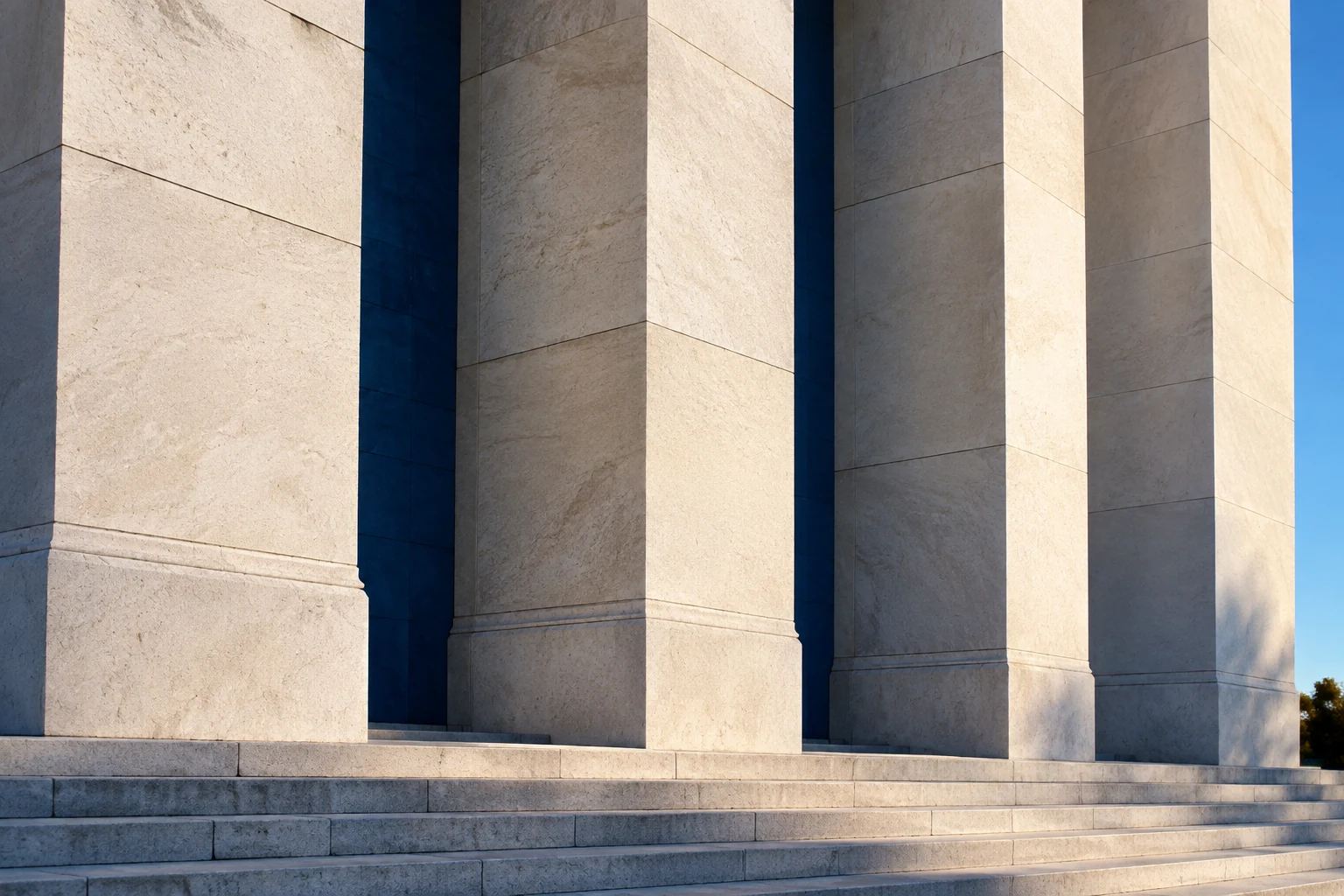 An architectural illustration of stone courthouse piers, fine surface detail and deep blue recesses.